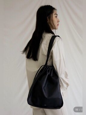 Ecrit HOAN Soft touch Black leather Bag Drawstring Fastening